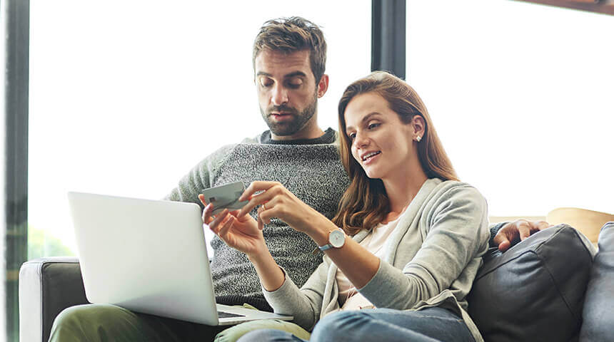 couple sitting on couch splurge