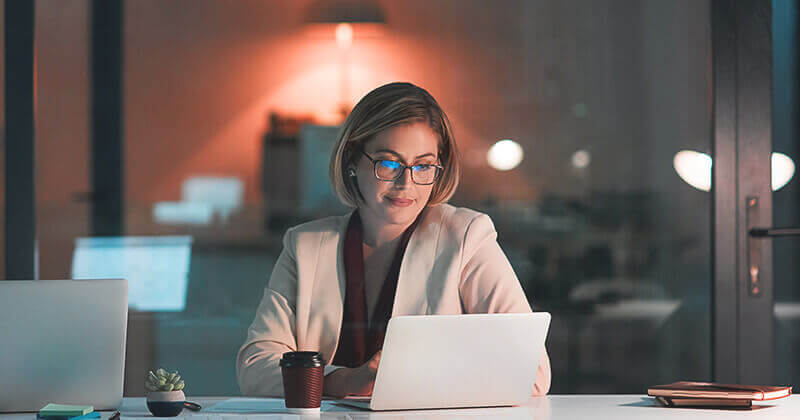 Person working on laptop at night
