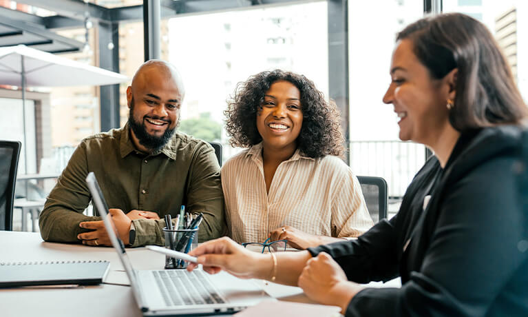 team of people working with a computer