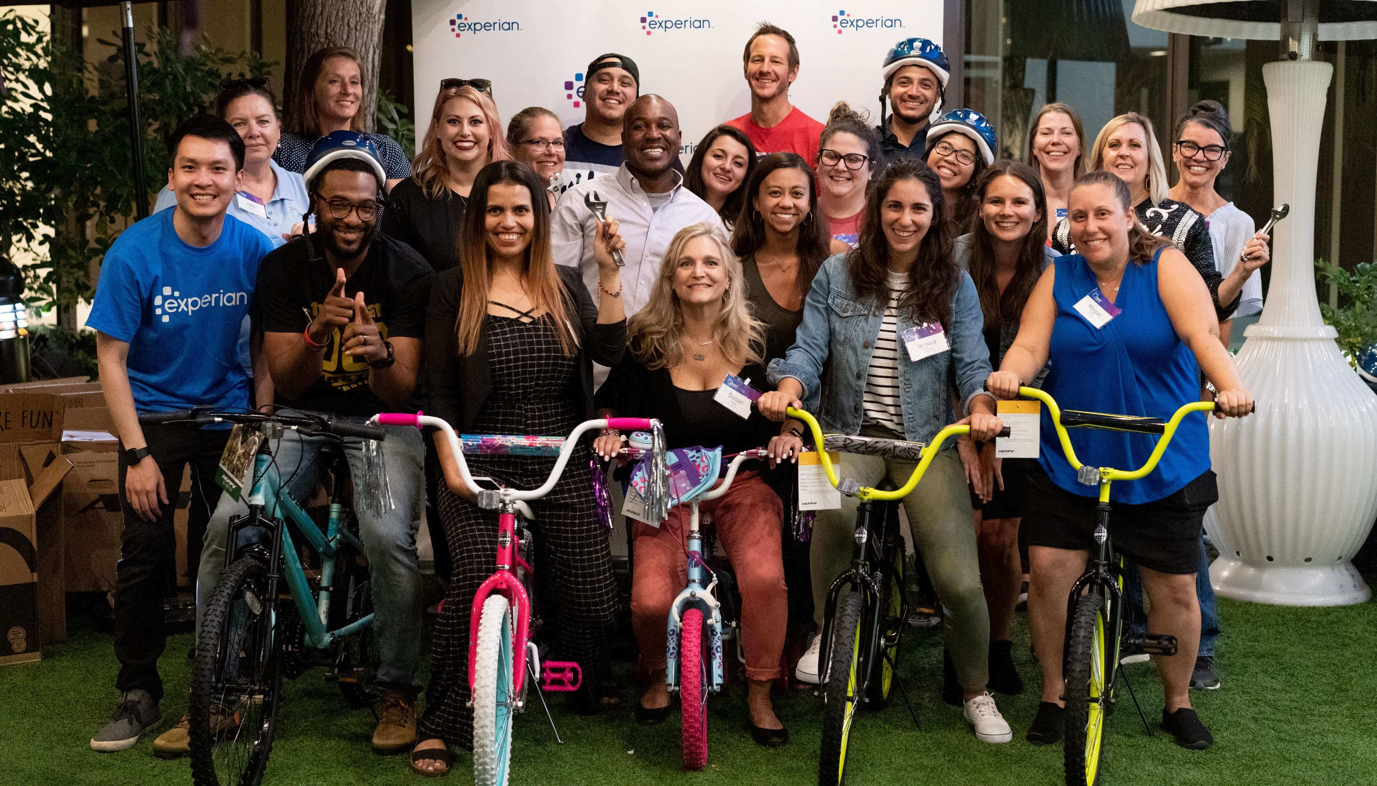 Experian employees gathered on bikes